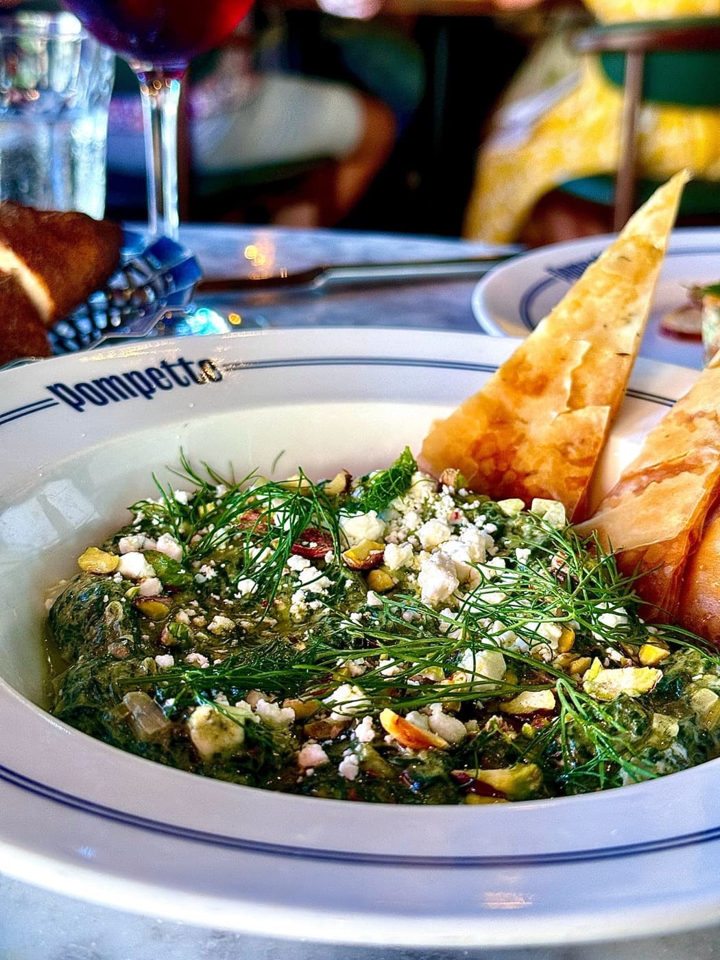 Creamed spinach and feta dip with pistachio and dill, served with filo crisps