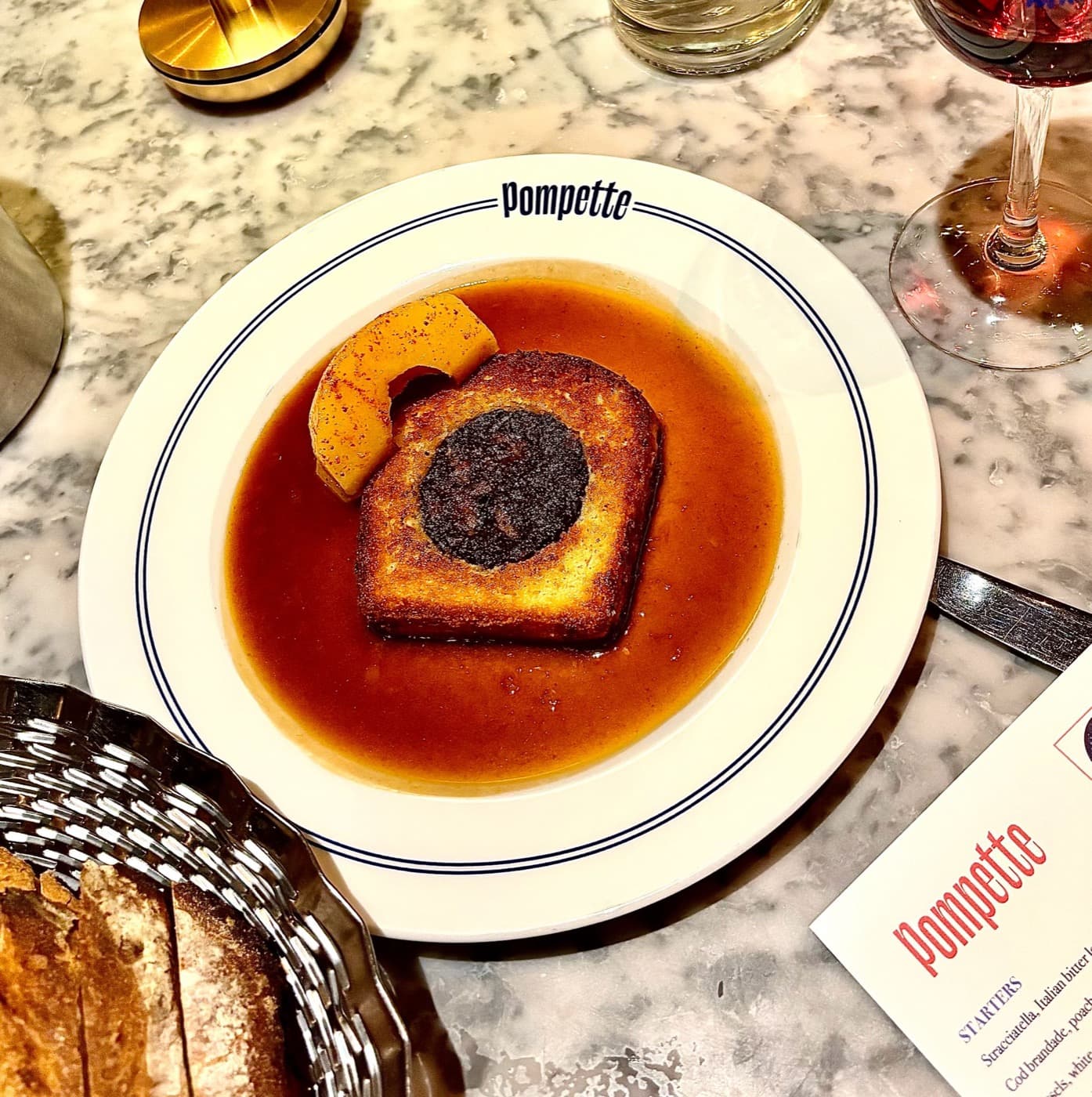 Boudin noir en brioche in a rich jus