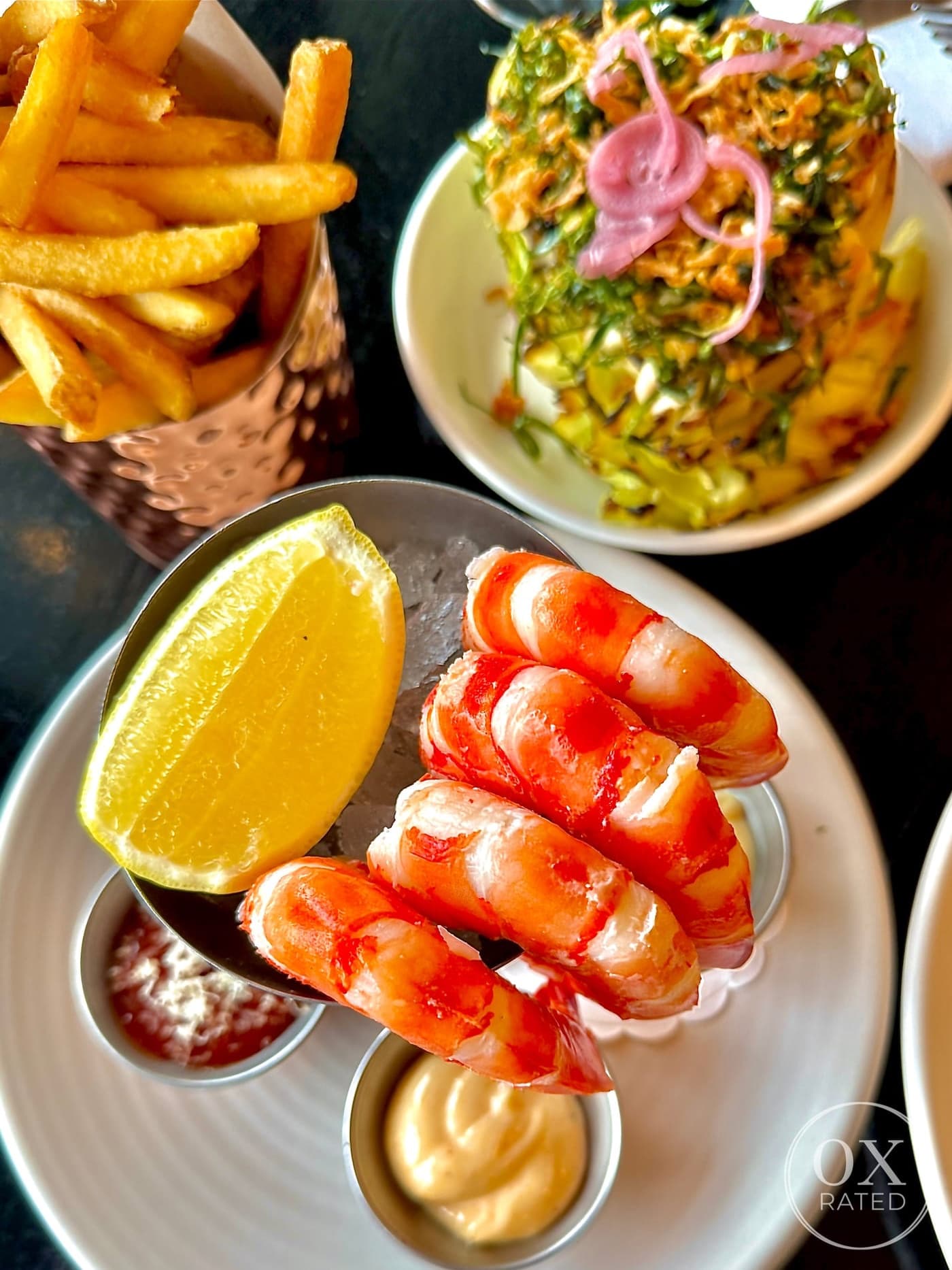 Shrimp cocktail with lemon and dipping sauces