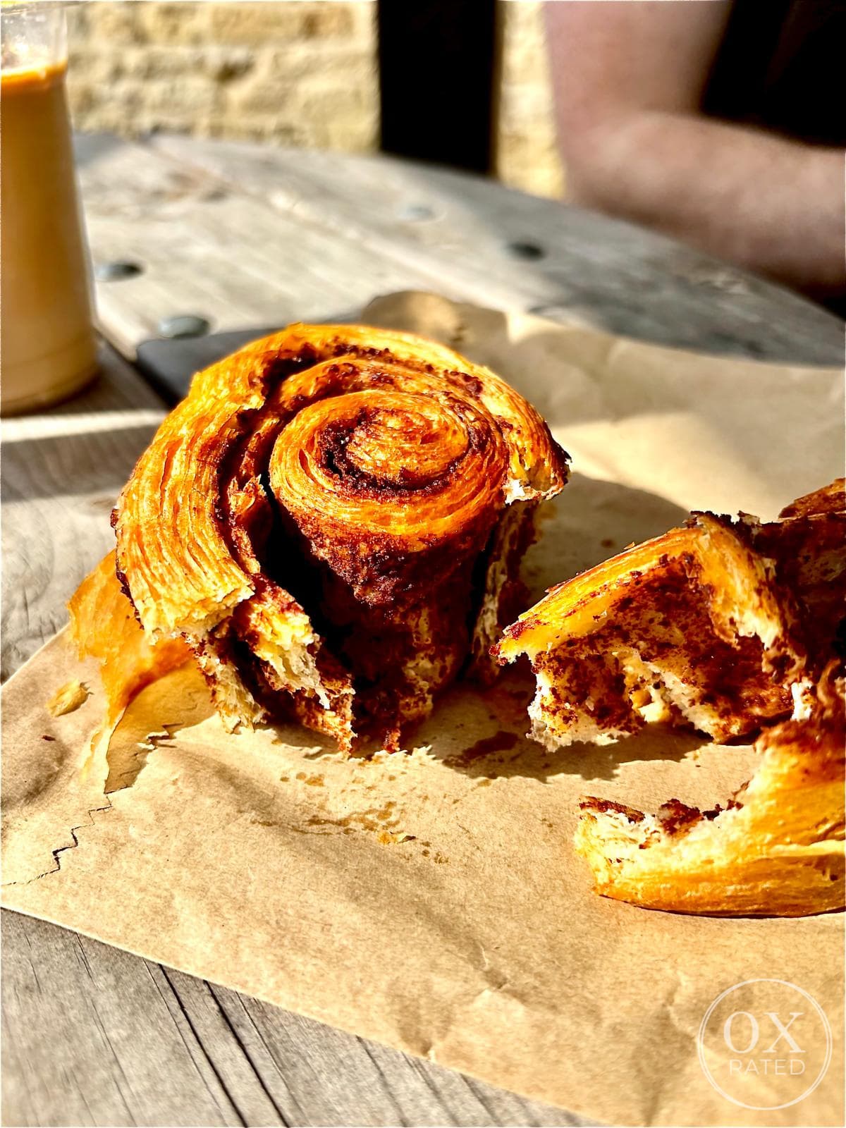 A cinnamon bun torn open