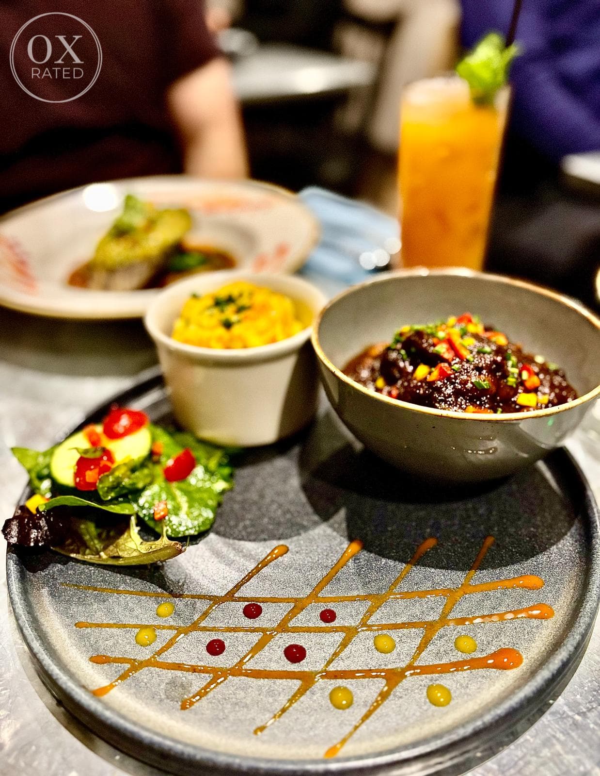 Oxtail served with rice and a side salad